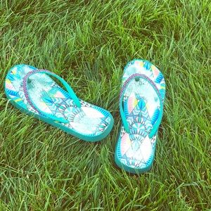 A pair of very used sandals (flip flops)